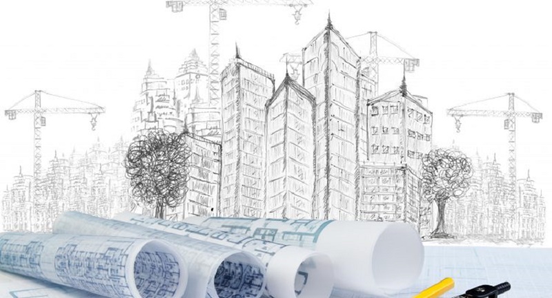 Diverse carte di progetti edilizi sul disegno in matita di un cantiere.